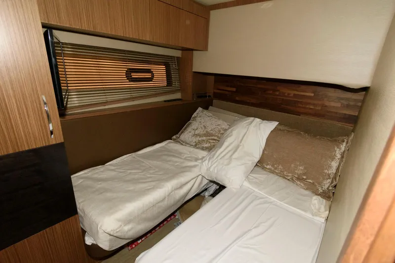 Slide: The Image of Cozy cabin interior of 2016 Sea Ray L590 Fly yacht with twin beds. - 39