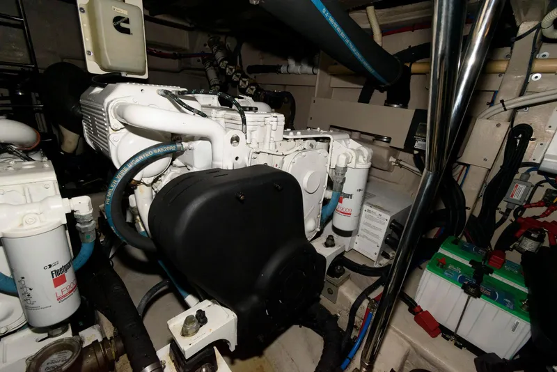 Slide: The Image of Engine room of 2016 Sea Ray L590 Fly yacht, showcasing mechanical components and systems. - 46