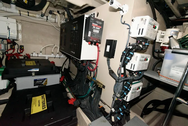Slide: The Image of Engine room of 2016 Sea Ray L590 Fly yacht with electrical components and batteries. - 47