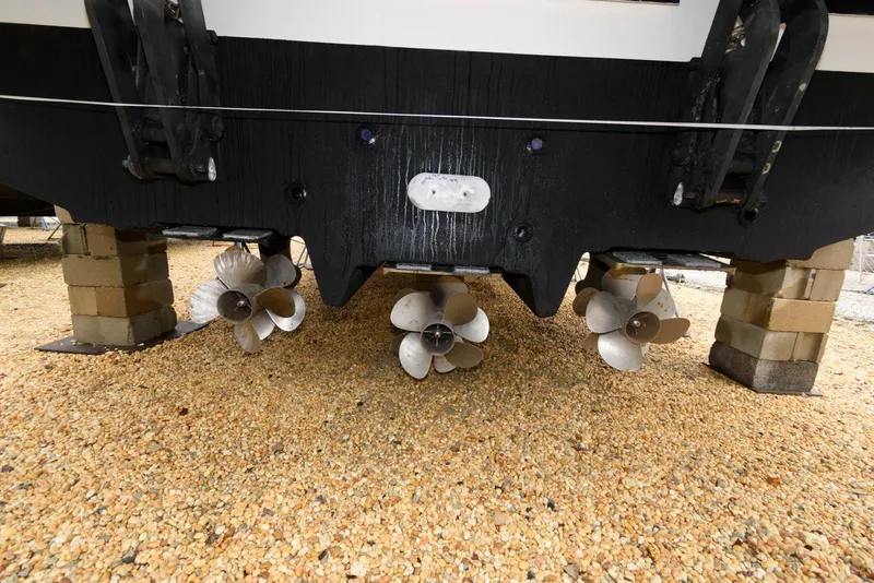 Slide: The Image of 2016 Sea Ray L590 Fly yacht propellers on dry dock, resting on blocks. - 49