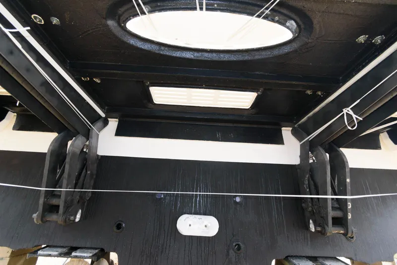 Slide: The Image of 2016 Sea Ray L590 Fly yacht interior ceiling with hatch and mechanical components. - 50