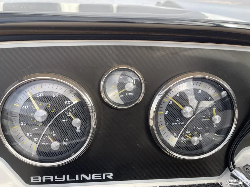 Slide: The Image of Dashboard of 2021 Bayliner DX 2250 boat with speedometer and gauges. - 14