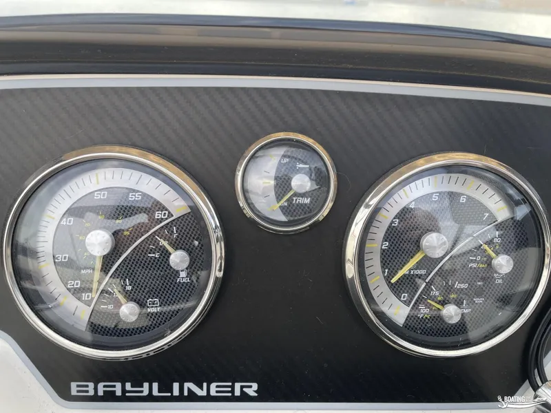 Slide: The Image of Dashboard of 2021 Bayliner DX 2250 with speedometer and gauges. - 15