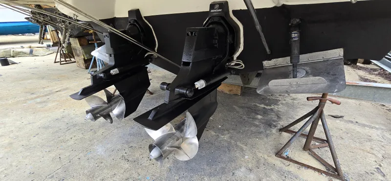 Slide: The Image of 2002 Monterey 322 Cruiser boat propellers and stern drive on dry dock. - 10
