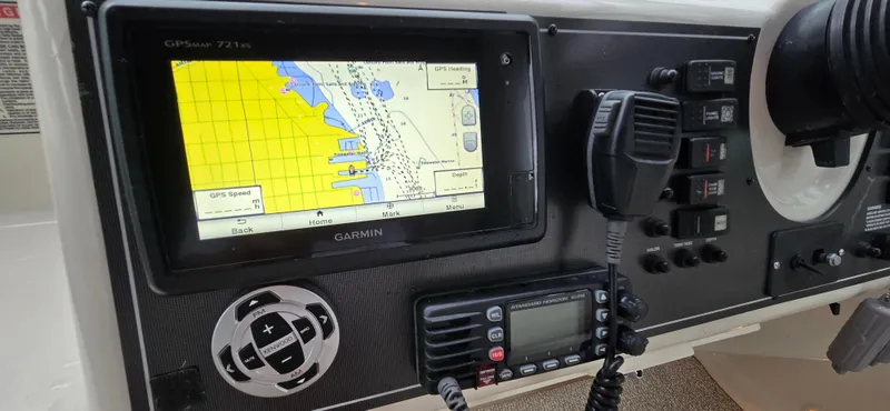 Slide: The Image of Garmin GPS and radio system on 2002 Monterey 322 Cruiser dashboard. - 13