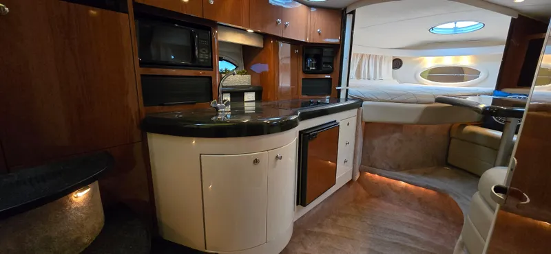 Slide: The Image of Interior of 2002 Monterey 322 Cruiser with kitchenette and cozy seating area. - 3