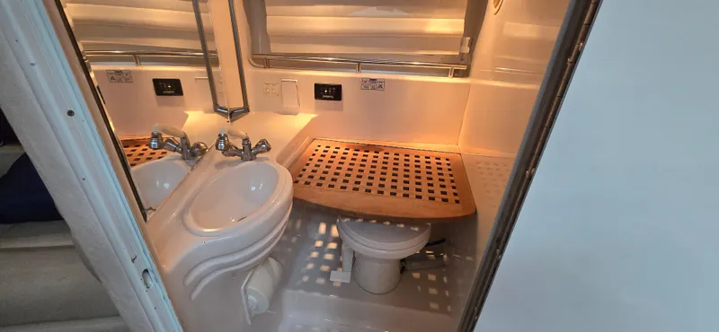Slide: The Image of Bathroom interior of 2002 Monterey 322 Cruiser with sink and toilet. - 8