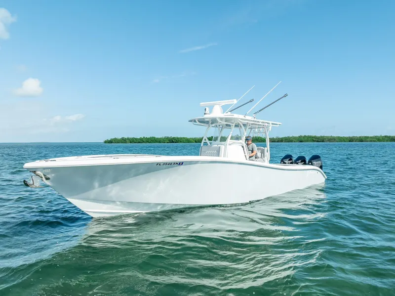 Slide: The Image of 2020 Yellowfin 34 boat cruising on clear blue water. - 1