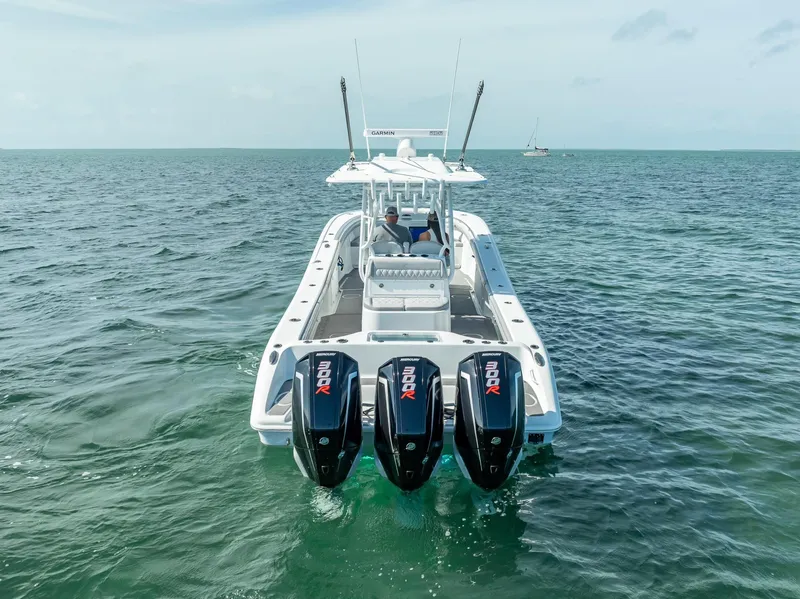 Slide: The Image of 2020 Yellowfin 34 boat with triple outboard engines on open water. - 11