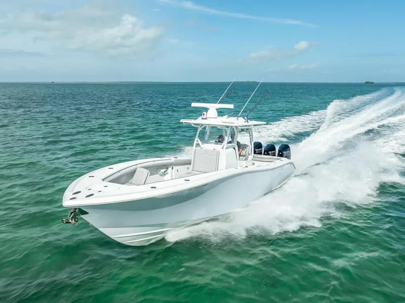 Slide: The Image of 2020 Yellowfin 34 boat cruising on clear blue ocean waters. - 24