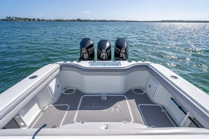 Slide: The Image of 2020 Yellowfin 34 boat with triple engines on open water. - 39