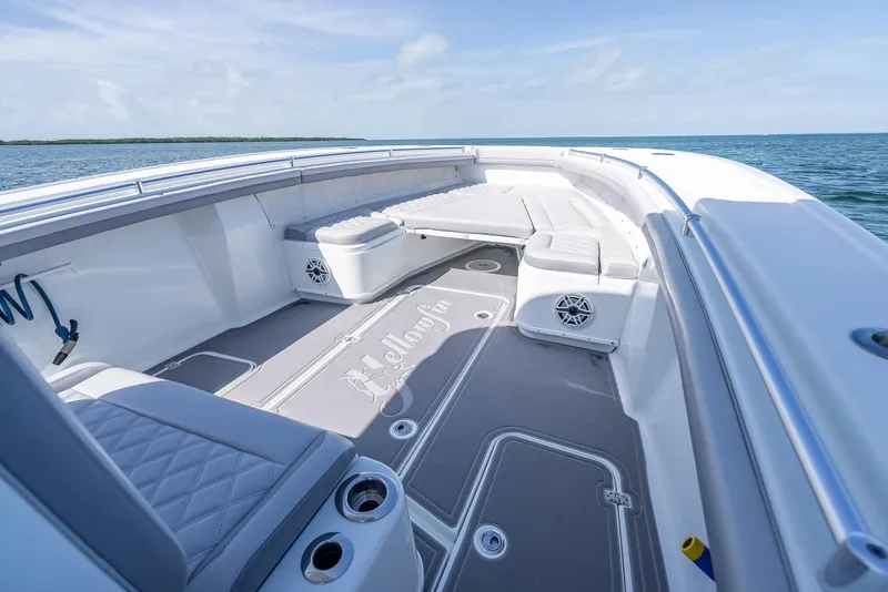 Slide: The Image of 2020 Yellowfin 34 boat interior with cushioned seating and ocean view. - 42