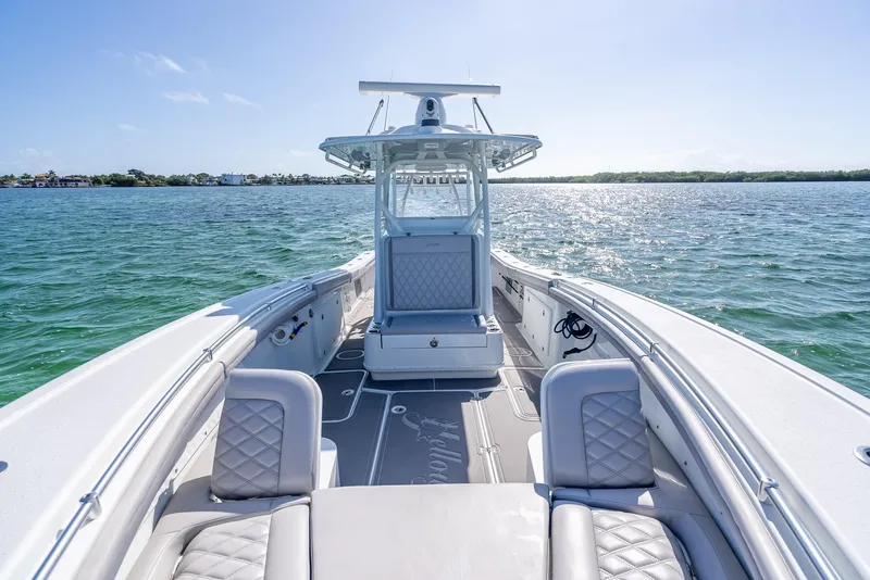 Slide: The Image of 2020 Yellowfin 34 boat on open water, featuring spacious seating and sleek design. - 44