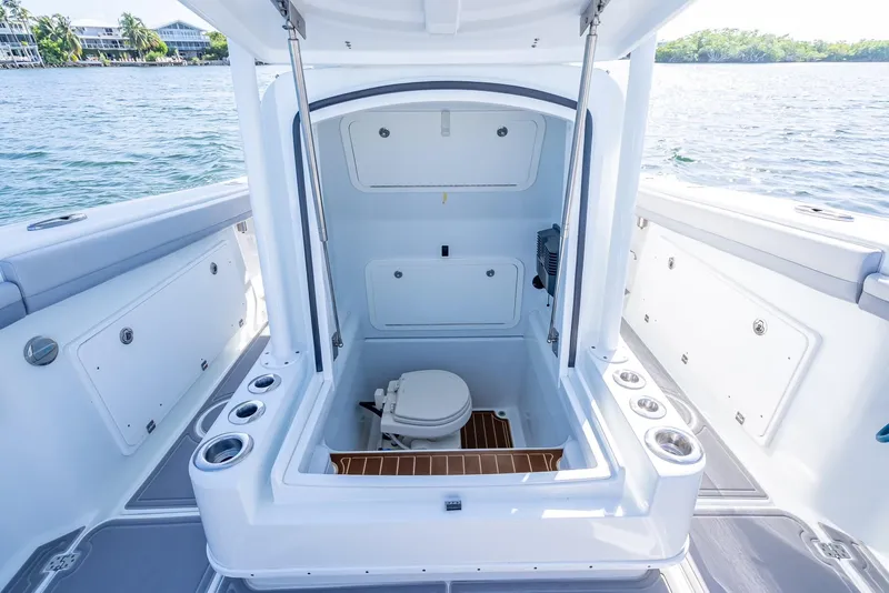 Slide: The Image of 2020 Yellowfin 34 boat interior with open hatch and marine toilet. - 47
