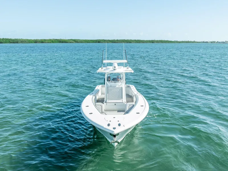 Slide: The Image of 2020 Yellowfin 34 boat on calm blue water. - 6