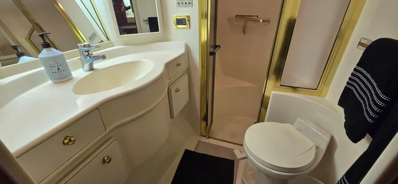 Slide: The Image of Luxurious bathroom in 1999 Sea Ray 50 Sundancer yacht with shower and vanity. - 22