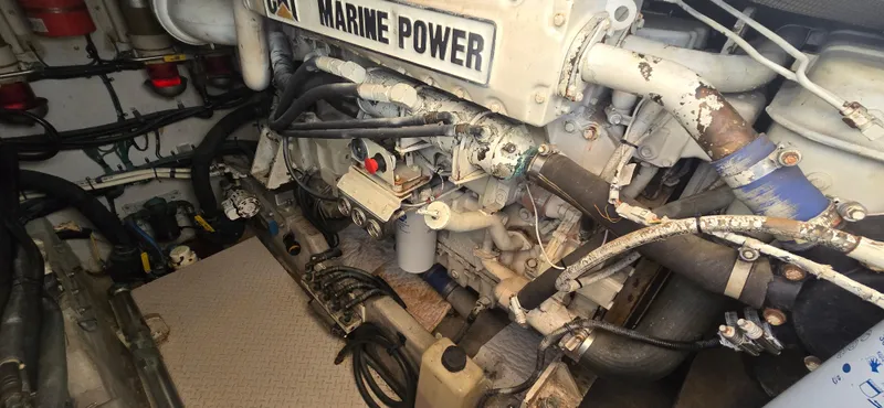 Slide: The Image of Engine room of 1999 Sea Ray 50 Sundancer with Marine Power components. - 24
