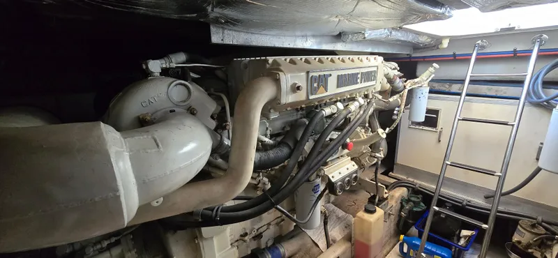 Slide: The Image of Engine room of 1999 Sea Ray 50 Sundancer with CAT marine power engine. - 26