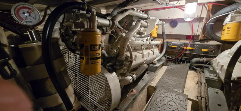 Slide: The Image of Engine room of 1989 Hatteras 40 Double Cabin with CAT filters and machinery. - 20
