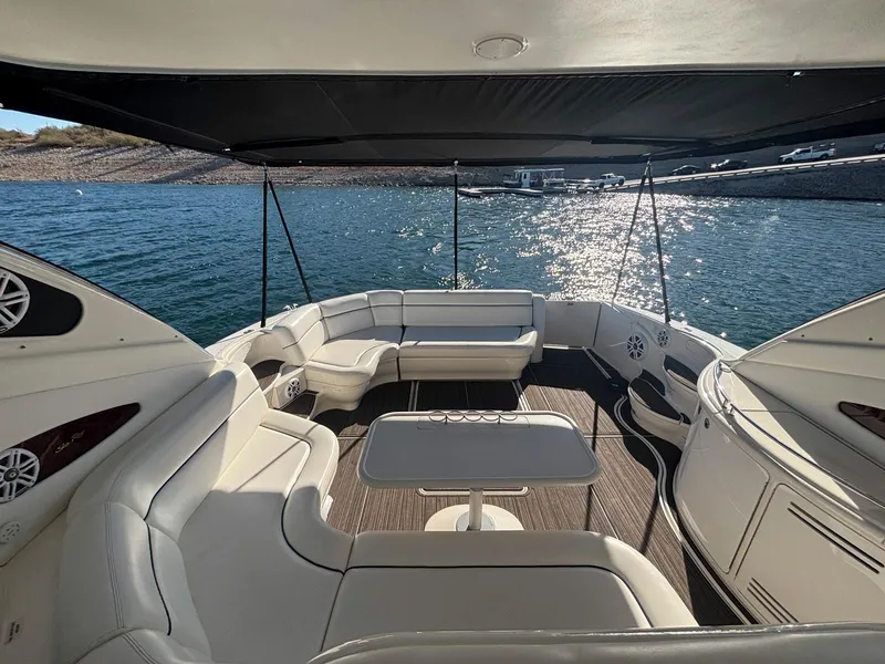 Slide: The Image of Luxurious 1999 Sea Ray 540 Sundancer yacht interior with spacious seating and scenic water view. - 11