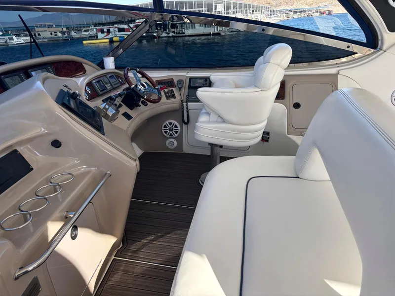 Slide: The Image of Luxurious 1999 Sea Ray 540 Sundancer yacht interior with plush seating and modern controls. - 12