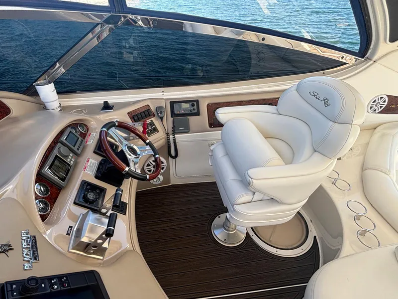 Slide: The Image of Interior helm of 1999 Sea Ray 540 Sundancer yacht with luxurious captain's chair. - 13