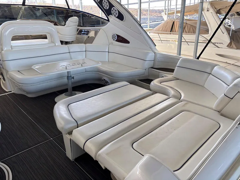 Slide: The Image of Luxurious interior of 1999 Sea Ray 540 Sundancer yacht with white leather seating. - 15