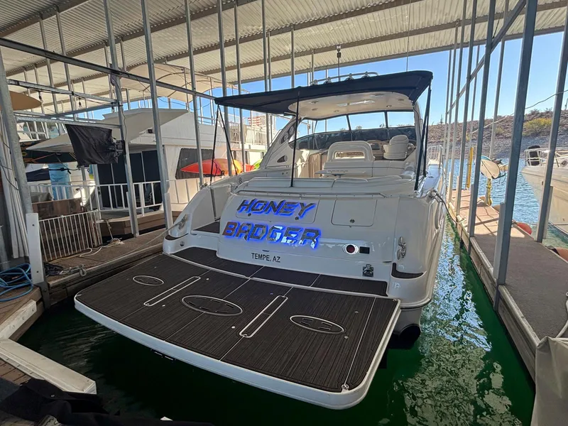 Slide: The Image of 1999 Sea Ray 540 Sundancer yacht docked in marina, rear view. - 18