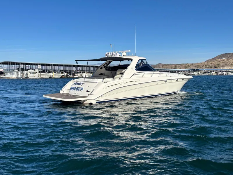 Slide: The Image of 1999 Sea Ray 540 Sundancer yacht cruising on a sunny day. - 3