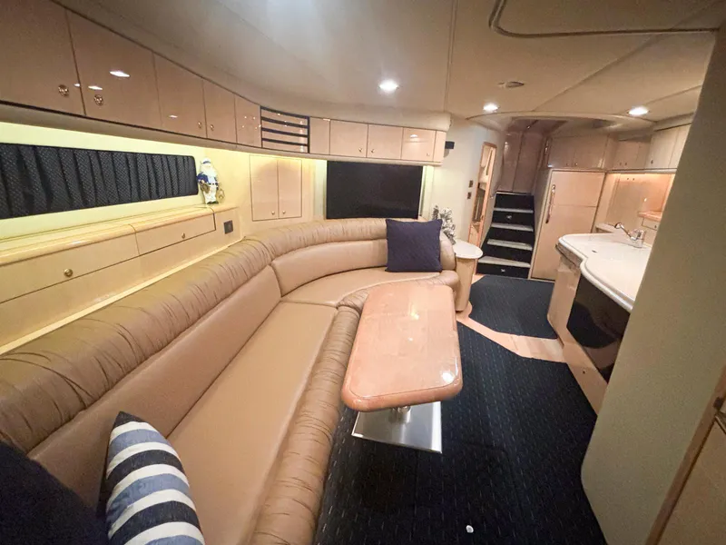 Slide: The Image of Luxurious interior of 1999 Sea Ray 540 Sundancer yacht with plush seating and modern amenities. - 31