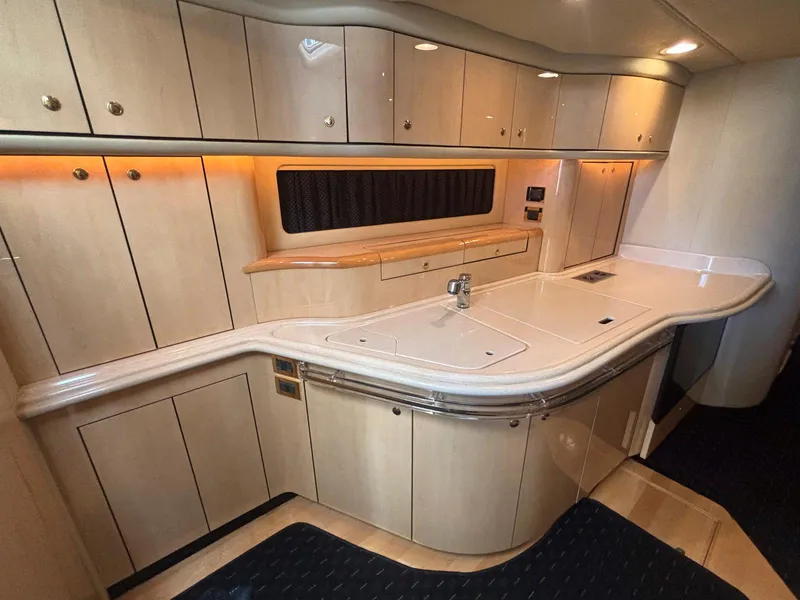 Slide: The Image of Luxurious 1999 Sea Ray 540 Sundancer yacht interior with sleek cabinetry and modern design. - 33