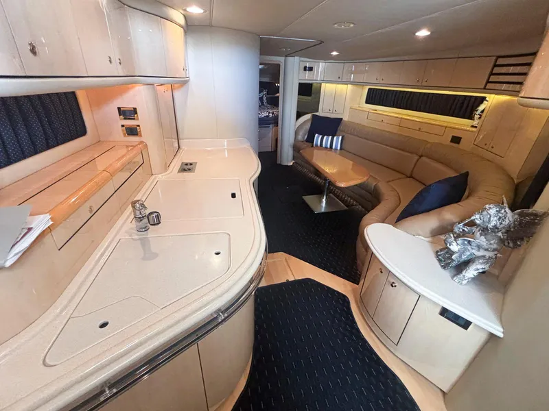Slide: The Image of Luxurious interior of 1999 Sea Ray 540 Sundancer yacht with modern amenities and elegant design. - 35