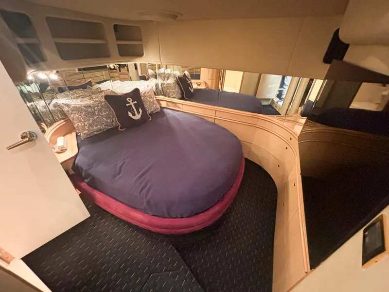 Slide: The Image of Luxurious 1999 Sea Ray 540 Sundancer cabin with cozy bed and nautical decor. - 36