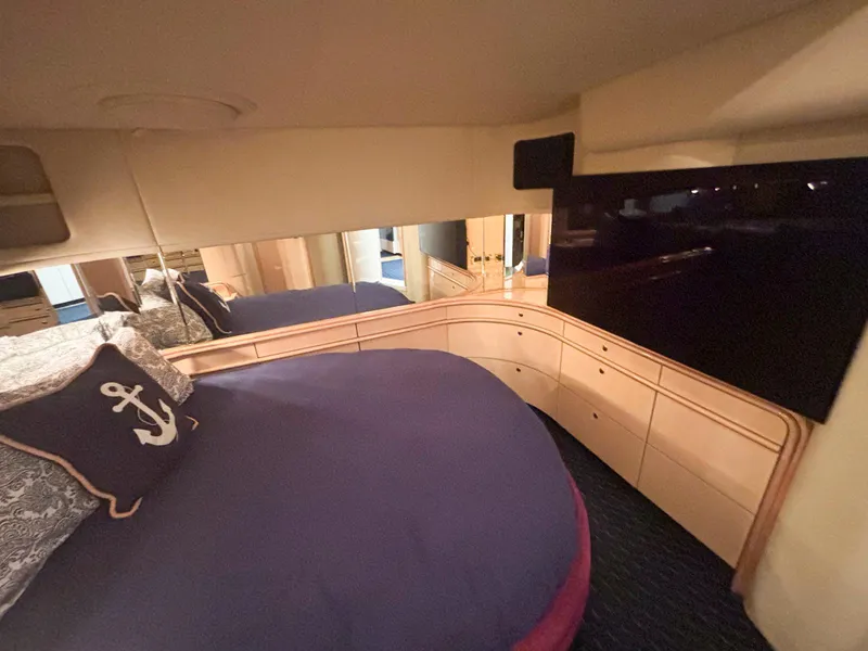 Slide: The Image of Luxurious bedroom interior of 1999 Sea Ray 540 Sundancer yacht with modern decor. - 37