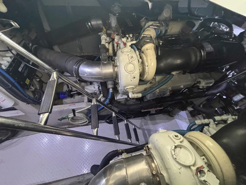 Slide: The Image of Engine room of 1999 Sea Ray 540 Sundancer with visible machinery and components. - 43