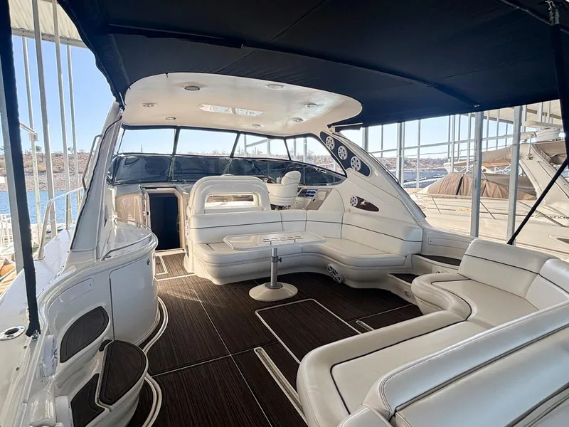 Slide: The Image of Luxurious 1999 Sea Ray 540 Sundancer yacht interior with white seating and sleek design. - 8