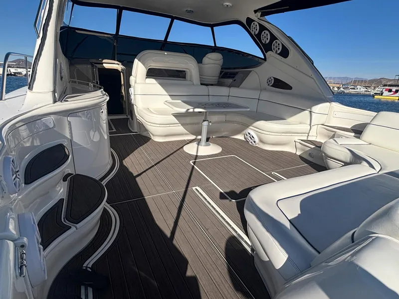 Slide: The Image of Luxurious 1999 Sea Ray 540 Sundancer yacht interior with white seating and sleek design. - 9