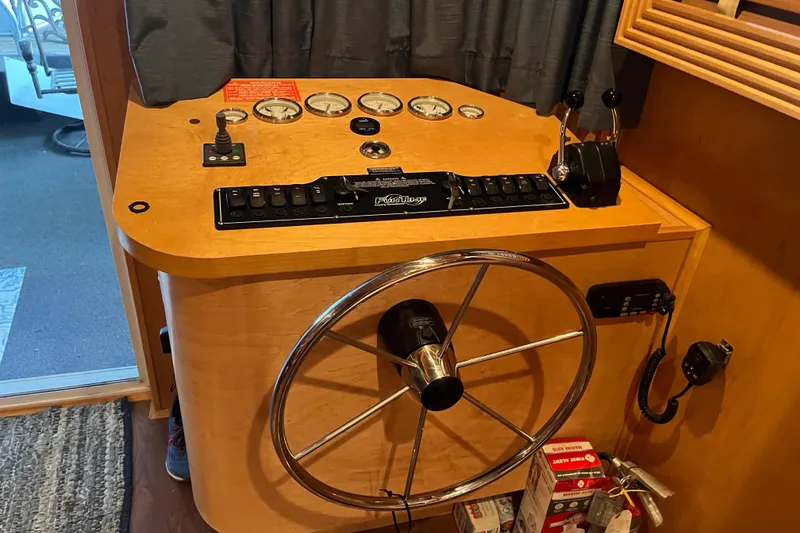 Slide: The Image of Steering console of a 2010 Funtime 68x16 boat with gauges and controls. - 13