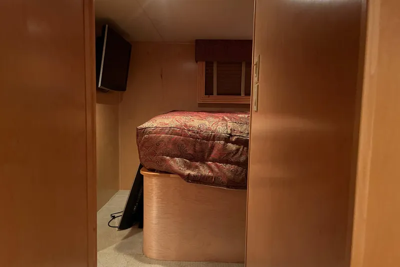 Slide: The Image of Cozy bedroom in 2010 Funtime 68x16 houseboat with TV and window. - 23