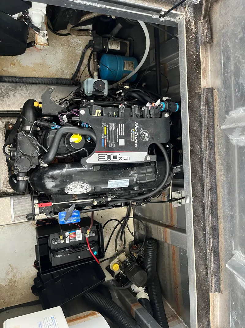 Slide: The Image of Engine compartment of 2010 Funtime 68x16 with visible components and wiring. - 30