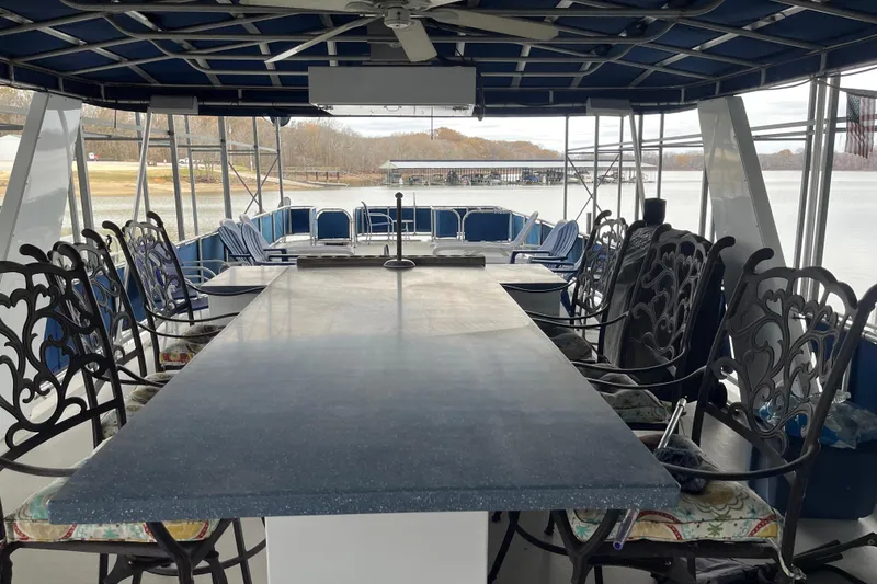 Slide: The Image of Spacious deck of 2010 Funtime 68x16 houseboat with elegant seating and scenic lake view. - 35