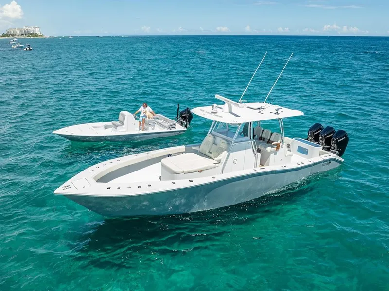 Slide: The Image of 2025 Billfish 39 Center Console boat on clear blue water. - 11