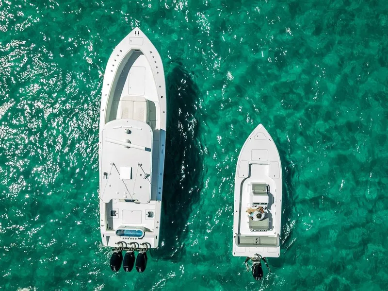 Slide: The Image of Aerial view of 2025 Billfish 39 Center Console boat on turquoise water. - 23