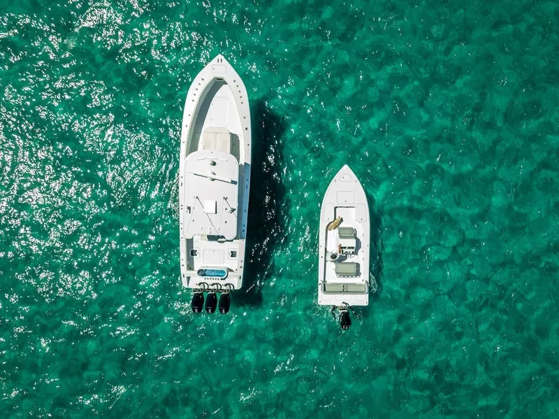 Slide: The Image of Aerial view of 2025 Billfish 39 Center Console boat on turquoise water. - 24