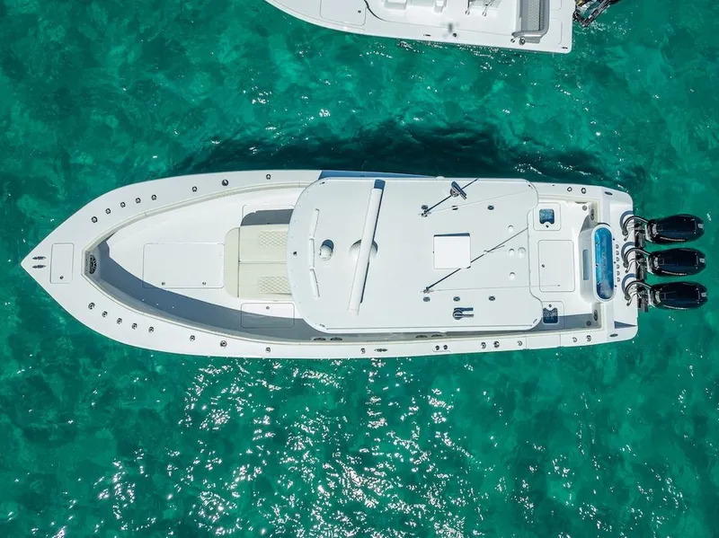 Slide: The Image of Aerial view of 2025 Billfish 39 Center Console boat on turquoise water. - 27