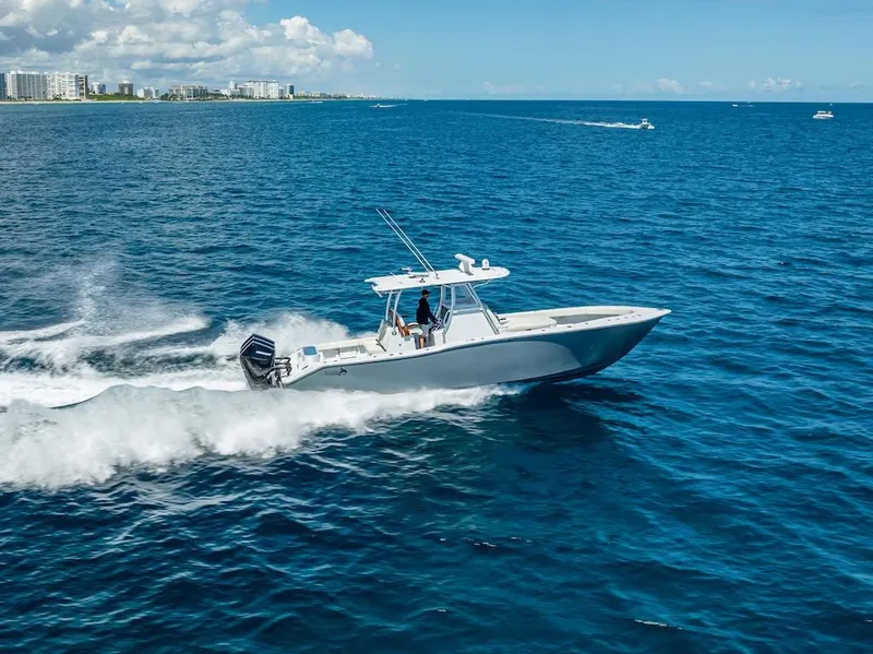 Slide: The Image of 2025 Billfish 39 Center Console boat cruising on open ocean. - 34