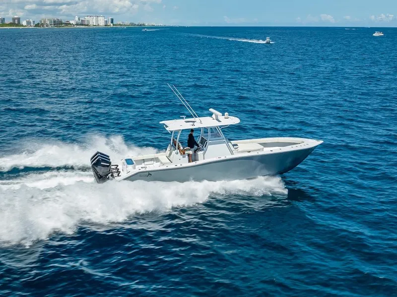 Slide: The Image of 2025 Billfish 39 Center Console boat cruising on open ocean. - 35