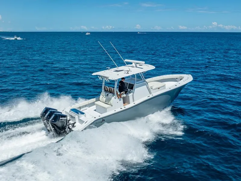 Slide: The Image of 2025 Billfish 39 Center Console boat cruising on open ocean. - 36