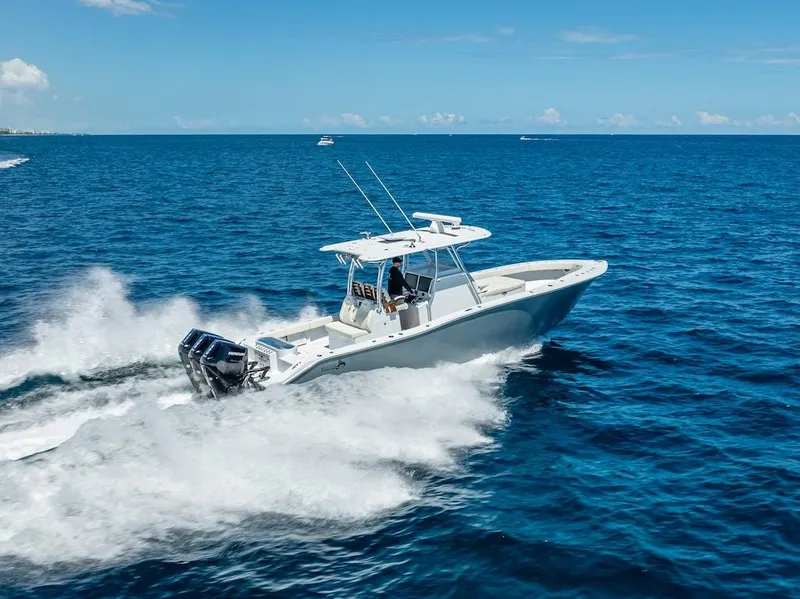 Slide: The Image of 2025 Billfish 39 Center Console boat cruising on open ocean. - 37