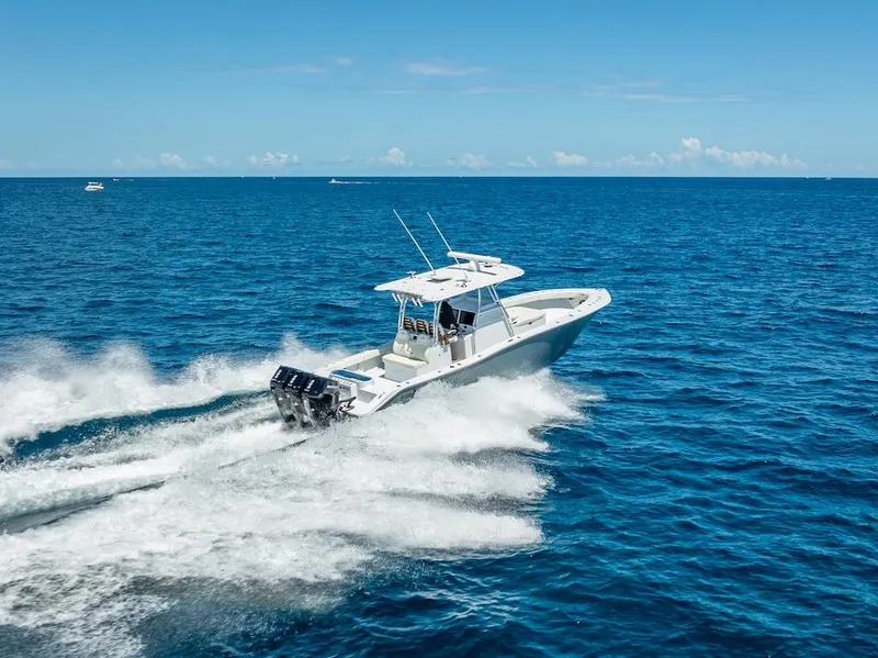 Slide: The Image of 2025 Billfish 39 Center Console boat speeding on open ocean. - 38